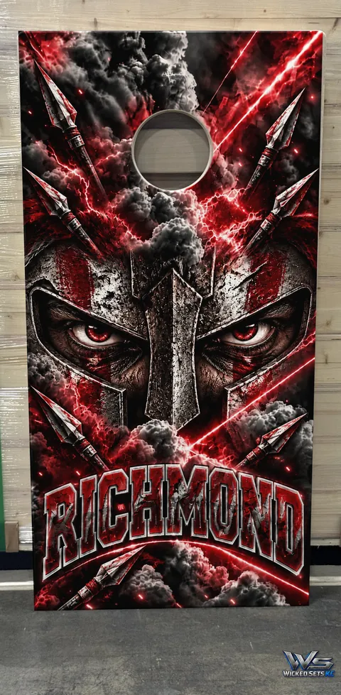 Red and silver board design with a helmeted warrior above the town name