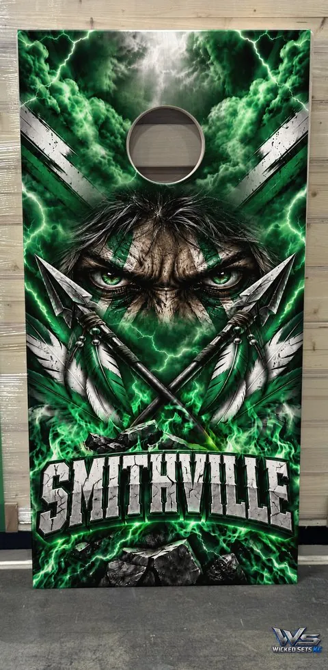 Green and white board design with a warrior and crossed spears above the town name